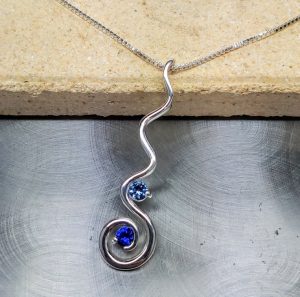 aquamarine and sapphire birthstone necklace custom created by the jeweler ryan
