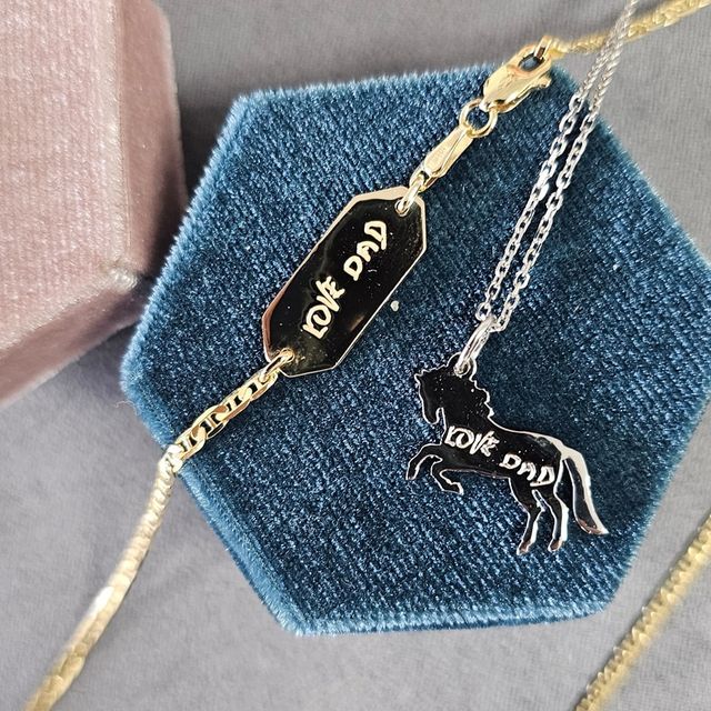 engraved necklace and bracelet created by the jeweler ryan