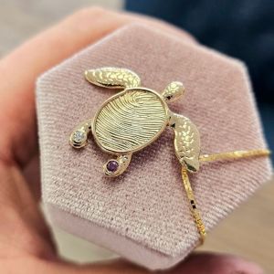 gold turtle fingerprint jewelry created by custom jeweler - the jeweler ryan